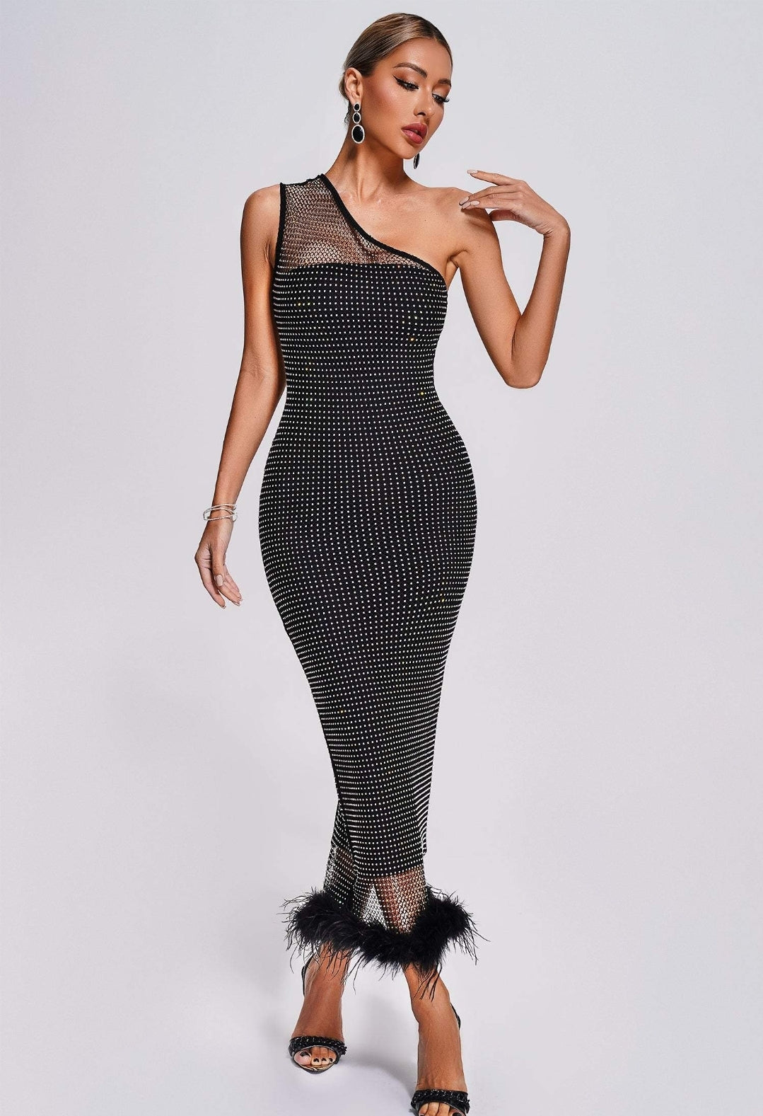 Vestido negro transparencia , bajo con plumas negras