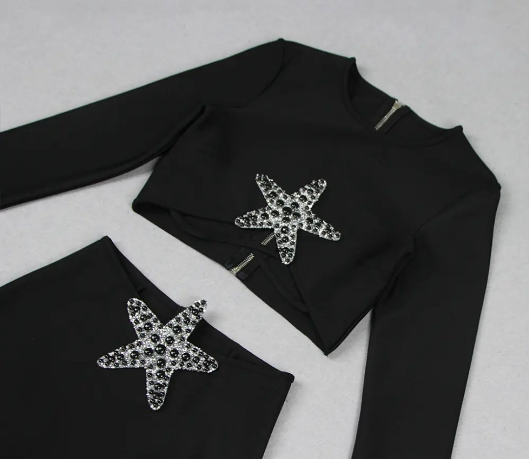 Conjunto dos piezas negro manga larga con detalle de estrella en falda y top